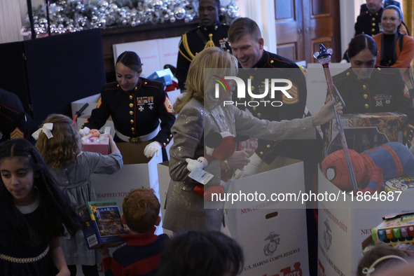 The First Lady Jill Biden holds a U.S. Marine Corps Reserve Toys for Tots event with local Marine Corps families in the East Room of the Whi...