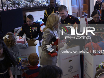 The First Lady Jill Biden holds a U.S. Marine Corps Reserve Toys for Tots event with local Marine Corps families in the East Room of the Whi...