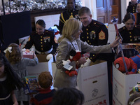 The First Lady Jill Biden holds a U.S. Marine Corps Reserve Toys for Tots event with local Marine Corps families in the East Room of the Whi...