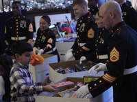 The First Lady Jill Biden holds a U.S. Marine Corps Reserve Toys for Tots event with local Marine Corps families in the East Room of the Whi...