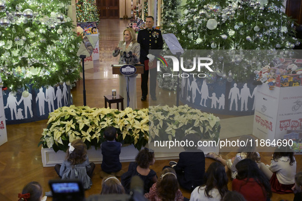 The First Lady Jill Biden holds a U.S. Marine Corps Reserve Toys for Tots event with local Marine Corps families in the East Room of the Whi...