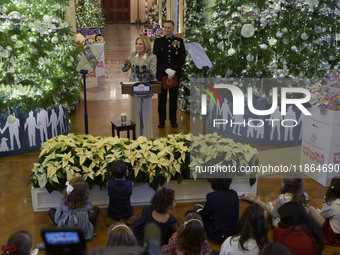 The First Lady Jill Biden holds a U.S. Marine Corps Reserve Toys for Tots event with local Marine Corps families in the East Room of the Whi...