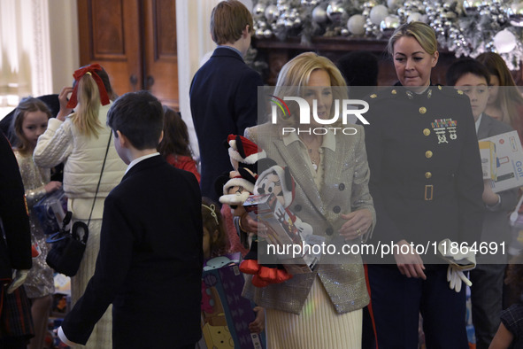 The First Lady Jill Biden holds a U.S. Marine Corps Reserve Toys for Tots event with local Marine Corps families in the East Room of the Whi...