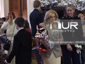 The First Lady Jill Biden holds a U.S. Marine Corps Reserve Toys for Tots event with local Marine Corps families in the East Room of the Whi...