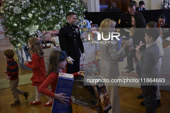 The First Lady Jill Biden holds a U.S. Marine Corps Reserve Toys for Tots event with local Marine Corps families in the East Room of the Whi...