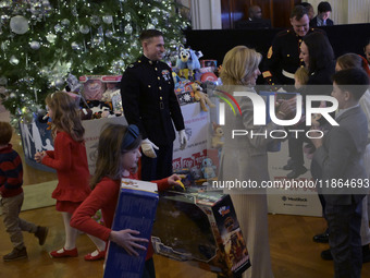 The First Lady Jill Biden holds a U.S. Marine Corps Reserve Toys for Tots event with local Marine Corps families in the East Room of the Whi...