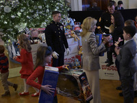 The First Lady Jill Biden holds a U.S. Marine Corps Reserve Toys for Tots event with local Marine Corps families in the East Room of the Whi...