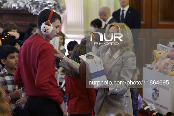 The First Lady Jill Biden holds a U.S. Marine Corps Reserve Toys for Tots event with local Marine Corps families in the East Room of the Whi...