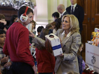 The First Lady Jill Biden holds a U.S. Marine Corps Reserve Toys for Tots event with local Marine Corps families in the East Room of the Whi...