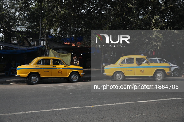 Taxi drivers wait for passengers with their iconic yellow Ambassador taxis in Kolkata, India, on December 13, 2024. The Calcutta High Court...