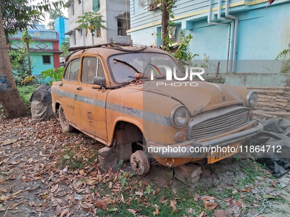 An abandoned iconic yellow Ambassador taxi is seen in Kolkata, India, on December 13, 2024. The Calcutta High Court orders that Kolkata's ic...