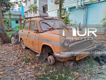 An abandoned iconic yellow Ambassador taxi is seen in Kolkata, India, on December 13, 2024. The Calcutta High Court orders that Kolkata's ic...