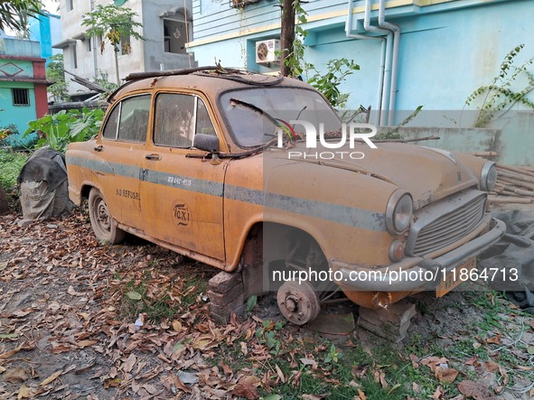 An abandoned iconic yellow Ambassador taxi is seen in Kolkata, India, on December 13, 2024. The Calcutta High Court orders that Kolkata's ic...