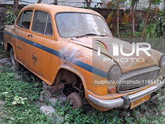 An abandoned iconic yellow Ambassador taxi is seen in Kolkata, India, on December 13, 2024. The Calcutta High Court orders that Kolkata's ic...