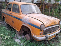 An abandoned iconic yellow Ambassador taxi is seen in Kolkata, India, on December 13, 2024. The Calcutta High Court orders that Kolkata's ic...