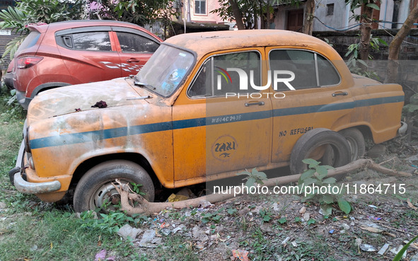 An abandoned iconic yellow Ambassador taxi is seen in Kolkata, India, on December 13, 2024. The Calcutta High Court orders that Kolkata's ic...