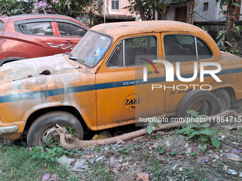 An abandoned iconic yellow Ambassador taxi is seen in Kolkata, India, on December 13, 2024. The Calcutta High Court orders that Kolkata's ic...