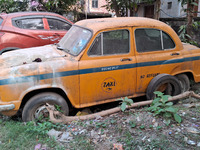 An abandoned iconic yellow Ambassador taxi is seen in Kolkata, India, on December 13, 2024. The Calcutta High Court orders that Kolkata's ic...