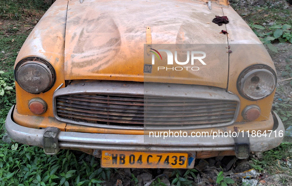 An abandoned iconic yellow Ambassador taxi is seen in Kolkata, India, on December 13, 2024. The Calcutta High Court orders that Kolkata's ic...