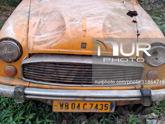 An abandoned iconic yellow Ambassador taxi is seen in Kolkata, India, on December 13, 2024. The Calcutta High Court orders that Kolkata's ic...