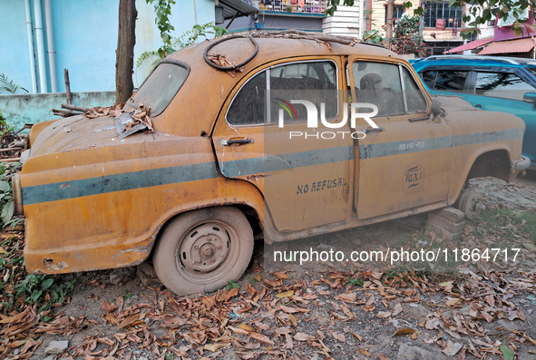 An abandoned iconic yellow Ambassador taxi is seen in Kolkata, India, on December 13, 2024. The Calcutta High Court orders that Kolkata's ic...