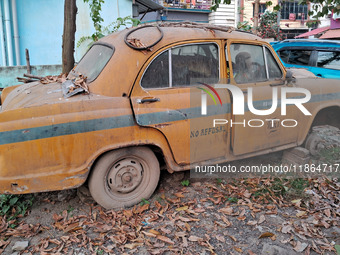 An abandoned iconic yellow Ambassador taxi is seen in Kolkata, India, on December 13, 2024. The Calcutta High Court orders that Kolkata's ic...