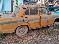 An abandoned iconic yellow Ambassador taxi is seen in Kolkata, India, on December 13, 2024. The Calcutta High Court orders that Kolkata's ic...