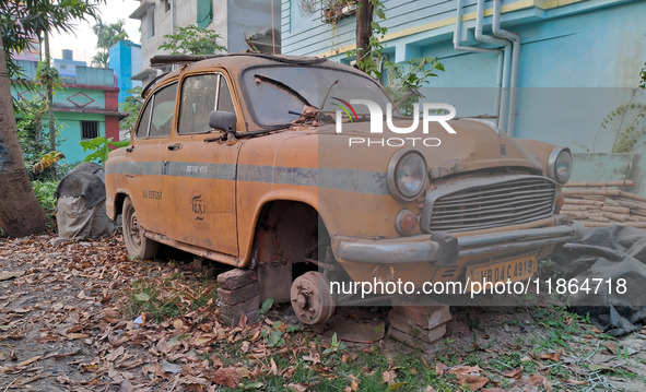 An abandoned iconic yellow Ambassador taxi is seen in Kolkata, India, on December 13, 2024. The Calcutta High Court orders that Kolkata's ic...