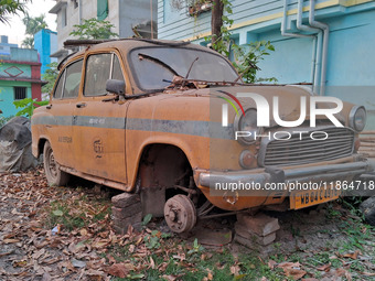 An abandoned iconic yellow Ambassador taxi is seen in Kolkata, India, on December 13, 2024. The Calcutta High Court orders that Kolkata's ic...