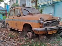 An abandoned iconic yellow Ambassador taxi is seen in Kolkata, India, on December 13, 2024. The Calcutta High Court orders that Kolkata's ic...