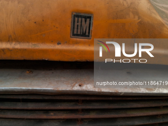 The logo of an abandoned iconic yellow ambassador taxi is seen in Kolkata, India, on December 13, 2024. The Calcutta High Court's order stat...