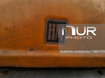 The logo of an abandoned iconic yellow ambassador taxi is seen in Kolkata, India, on December 13, 2024. The Calcutta High Court's order stat...