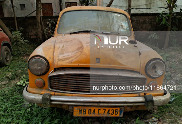 An abandoned iconic yellow Ambassador taxi is seen in Kolkata, India, on December 13, 2024. The Calcutta High Court's 2008 order states that...