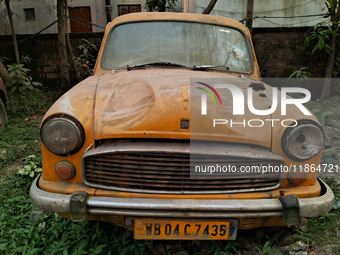 An abandoned iconic yellow Ambassador taxi is seen in Kolkata, India, on December 13, 2024. The Calcutta High Court's 2008 order states that...