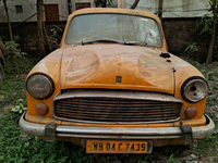 An abandoned iconic yellow Ambassador taxi is seen in Kolkata, India, on December 13, 2024. The Calcutta High Court's 2008 order states that...