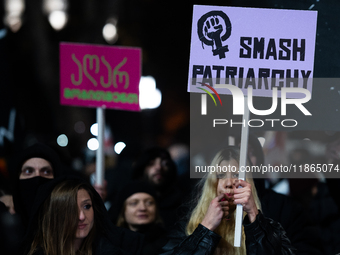 Anti-government protesters demonstrate against the Georgian government's postponement of European Union accession talks until 2028, in Tbili...