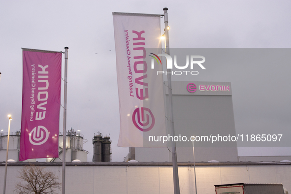 A general view of the logo of the Evonik Chemical plant in Wesseling near Cologne, Germany, on December 13, 2024, as Evonik plans to cut 7,0...