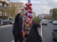 An Iranian family takes a selfie with Christmas decorations put up by the municipality of District Six while Christmas shopping in downtown...