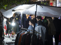 A young Iranian woman shops for Christmas accessories from a vendor in downtown Tehran, Iran, on December 13, 2024. Iranian-Christians celeb...