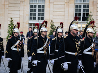 The French Republican Guard is seen before the handover ceremony between Michel Barnier, the outgoing Prime Minister, and Francois Bayrou, t...