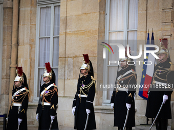 The French Republican Guard is seen before the handover ceremony between Michel Barnier, the outgoing Prime Minister, and Francois Bayrou, t...