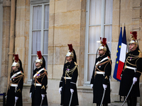 The French Republican Guard is seen before the handover ceremony between Michel Barnier, the outgoing Prime Minister, and Francois Bayrou, t...