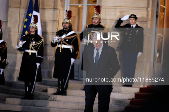 Michel Barnier, the resigning Prime Minister, is seen at the Matignon entrance during the handover ceremony between Michel Barnier, the outg...