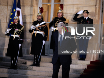 Michel Barnier, the resigning Prime Minister, is seen at the Matignon entrance during the handover ceremony between Michel Barnier, the outg...