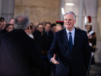 In Paris, France, on December 13, 2024, Michel Barnier, the resigning prime minister, receives Francois Bayrou at the Matignon entrance duri...