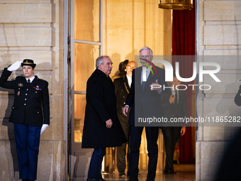 In Paris, France, on December 13, 2024, Michel Barnier, the resigning prime minister, receives Francois Bayrou at the Matignon entrance duri...