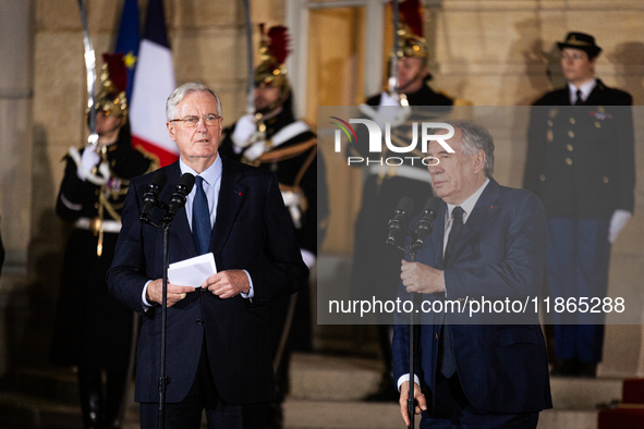 Michel Barnier, the resigning prime minister, and Francois Bayrou, are seen during the speech of the handover ceremony between Michel Barnie...