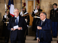 Michel Barnier, the resigning prime minister, and Francois Bayrou, are seen during the speech of the handover ceremony between Michel Barnie...