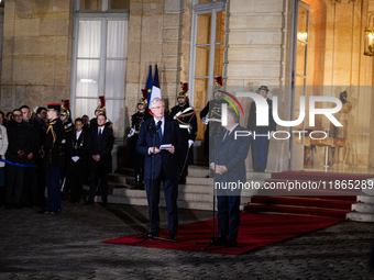 Michel Barnier, the resigning prime minister, and Francois Bayrou, are seen during the speech of the handover ceremony between Michel Barnie...