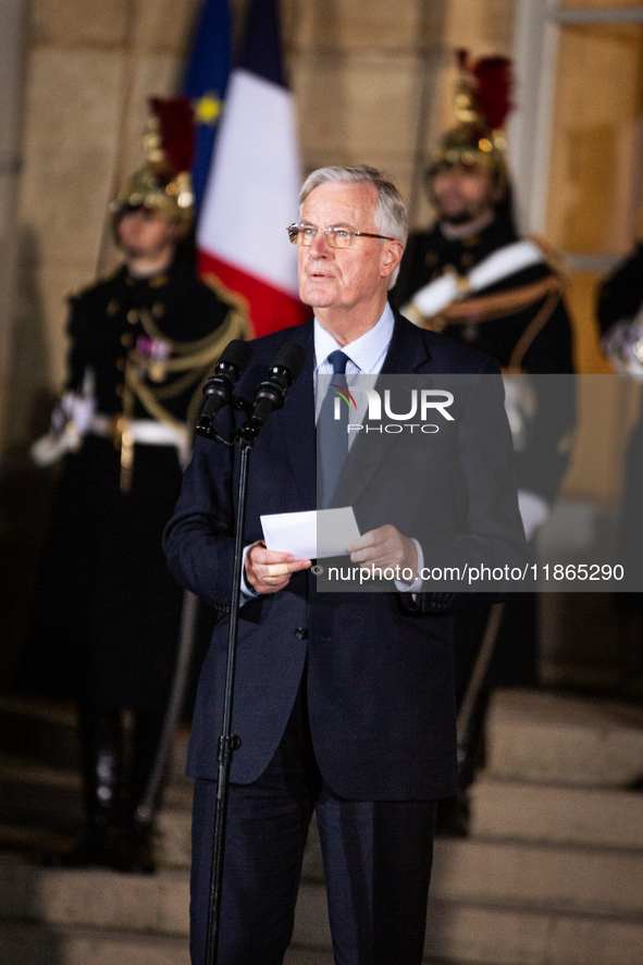 In Paris, France, on December 13, 2024, Michel Barnier, the resigning Prime Minister, speaks during the handover ceremony between himself, t...